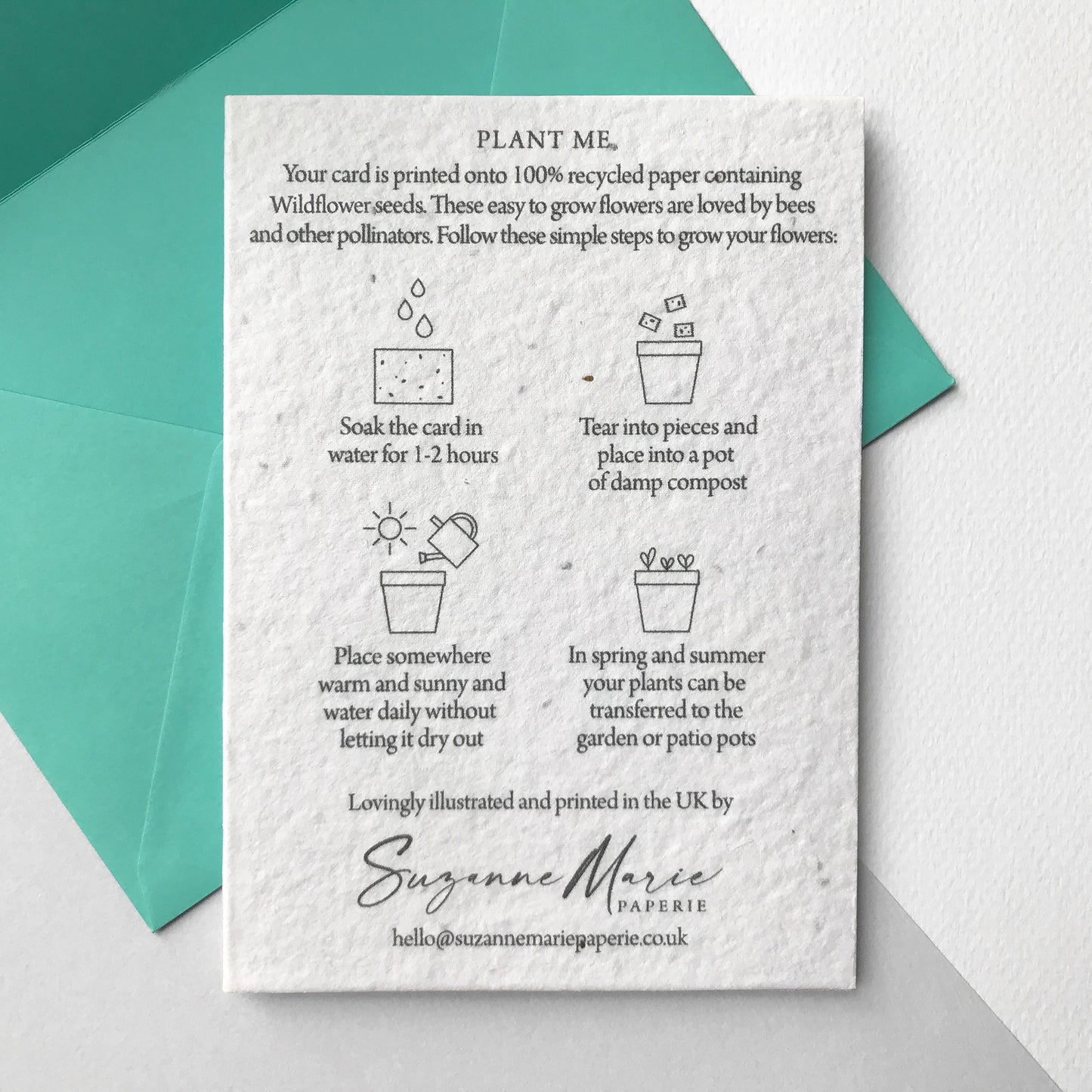 Image shows the back of the Bloom Cards plantable seed paper new home card featuring easy to follow planting instructions by Suzanne Marie Paperie.