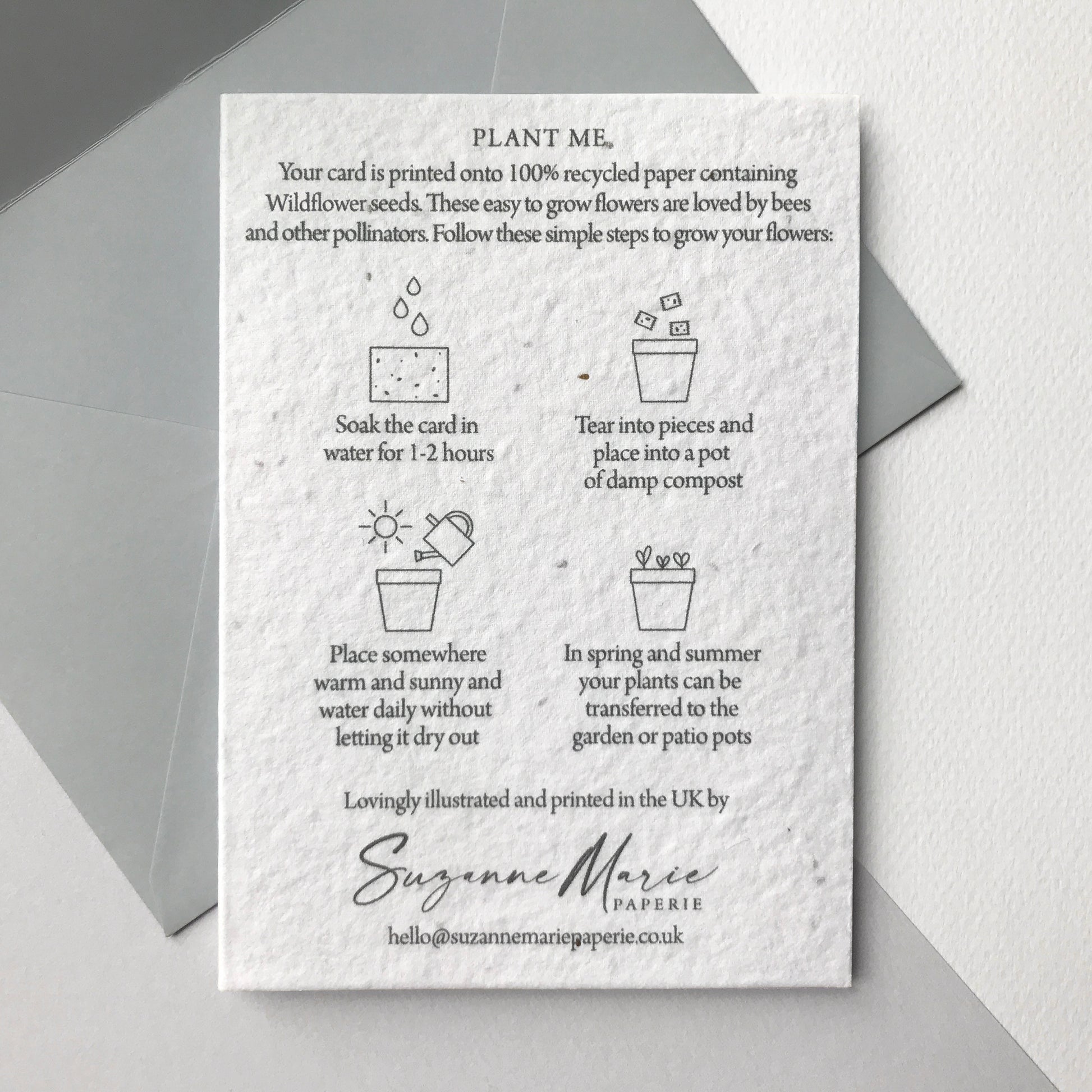 Image shows the back of the plantable seed paper engagement card featuring easy to follow planting instructions by Suzanne Marie Paperie.